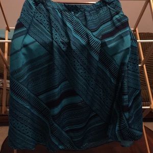 Navy blue, turquoise print skirt with pockets.